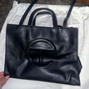 Used navy blue telfar